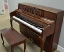 Kawai dark cherry console piano